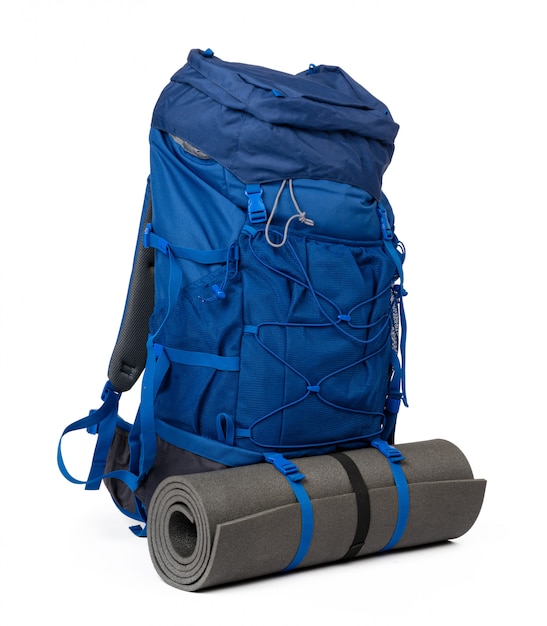 Photo blue hiking backpack with fitness mat isolated on white