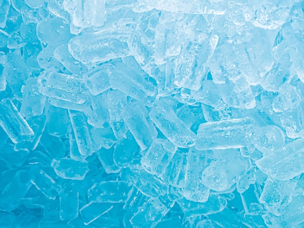 A blue ice bucket with ice on it