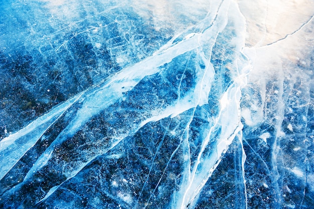 Blue ice on the frozen lake. Winter nature background