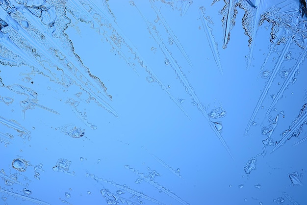 blue ice glass background, abstract texture of the surface of the ice on the glass, frozen seasonal water