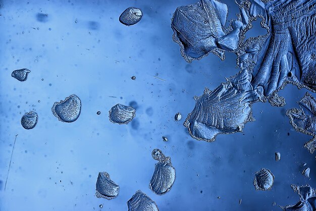 blue ice glass background, abstract texture of the surface of the ice on the glass, frozen seasonal water