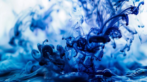 Photo blue ink in water abstract background closeup shot