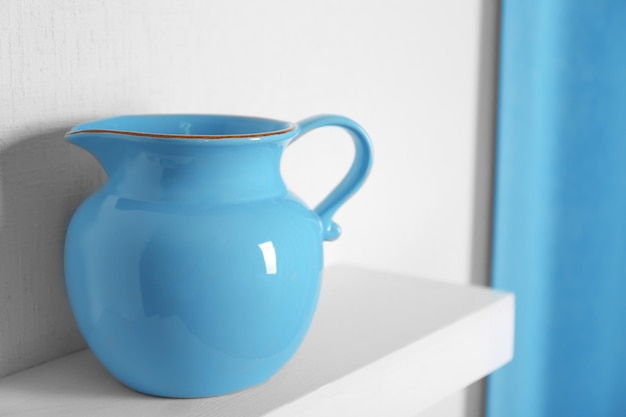 Blue jar on a shelf closeup