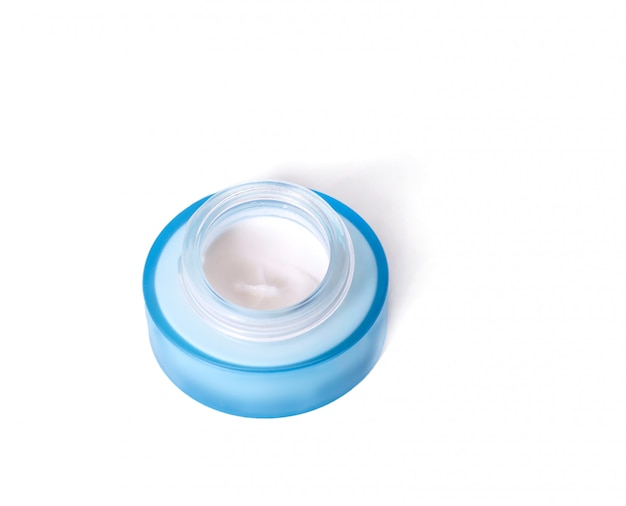 Photo blue jar with cream on white background