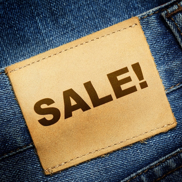 Blue jeans label with word SALE