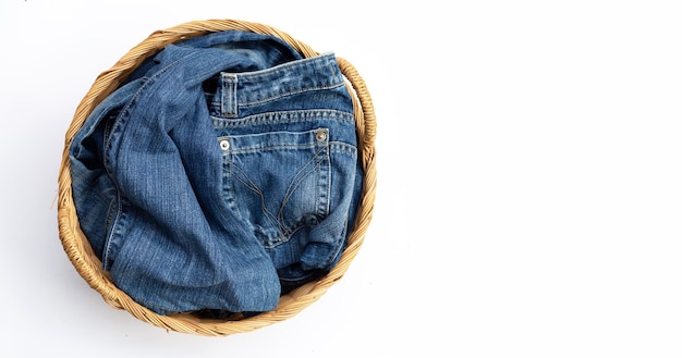 Blue jeans in laundry basket