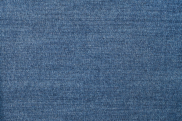 Photo blue jeans, material of denim texture.