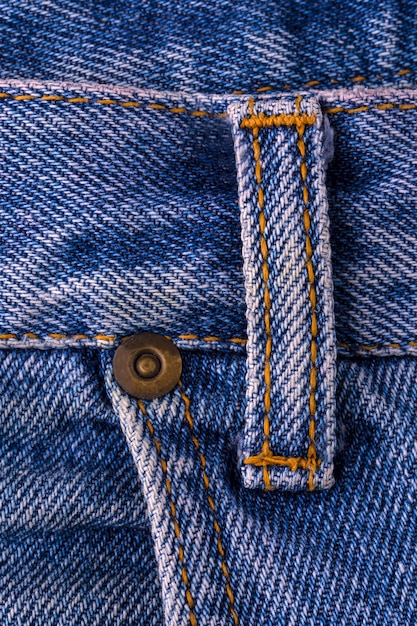 Blue jeans texture fragment closeup background