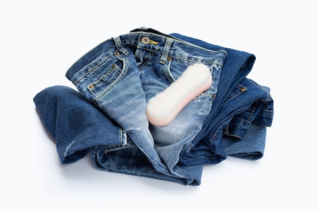 Blue jeans with cloth washing brush.