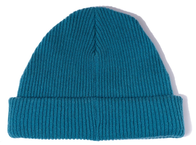 Blue knitted hat on a white isolated background