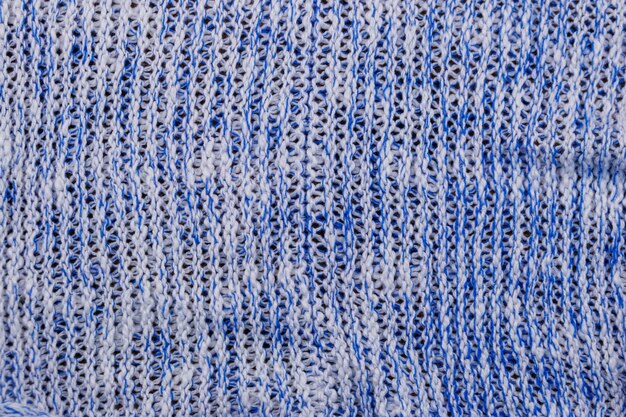 Blue knitting texture. Knitted cloth background