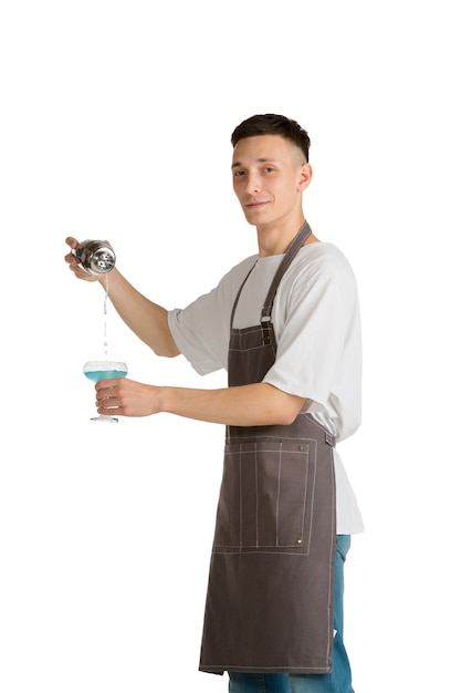 Blue lagoon Portrait of a young male caucasian barista or bartender in brown apron smiling
