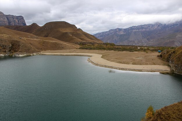 blue lake among the mountains a fascinating sight location lake gizhgit bylym elbrus district caucasus autumn landscape