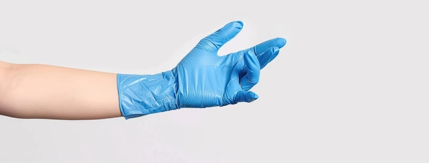 Photo blue latex glove hand gesture on white