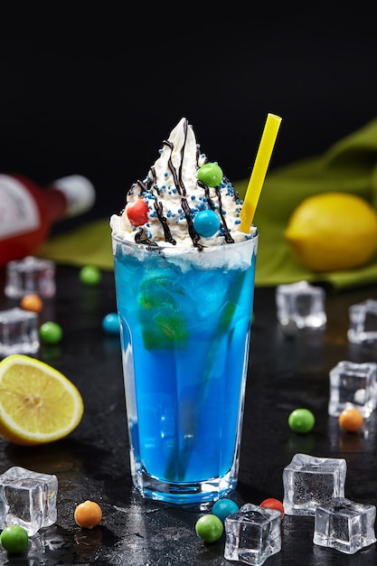 Blue lemonade with whipped cream topped and balls of chewing gum