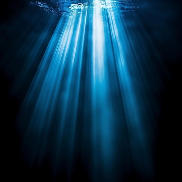 Photo a blue light in the water is shining through a dark background