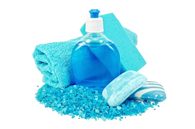 Blue liquid soap in a bottle, solid blue striped and mottled soap, bath salt, blue towel and sponge isolated on white background