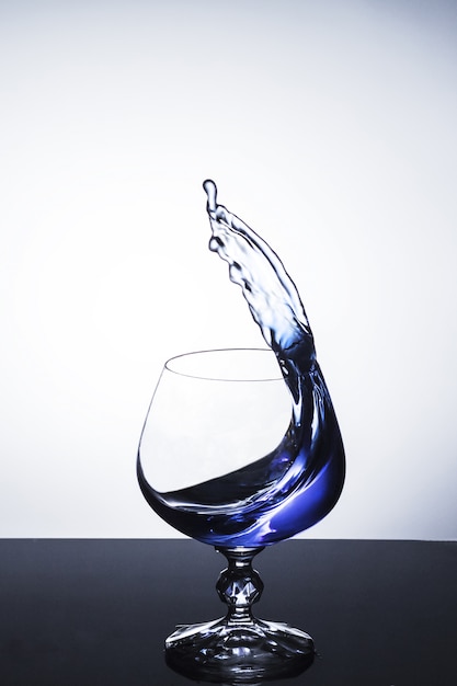 Blue Liquid Splashing of Wine Glass