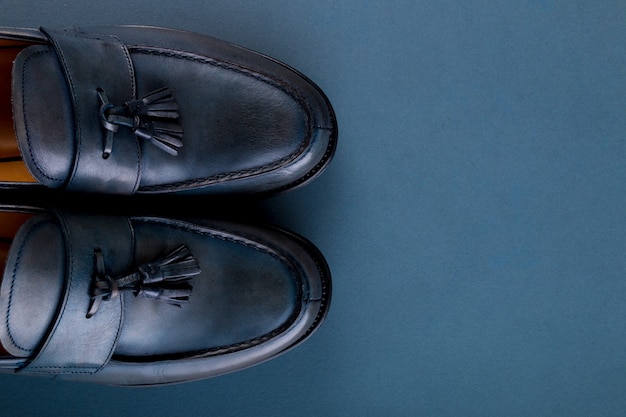 Blue loafer shoes on blue surface