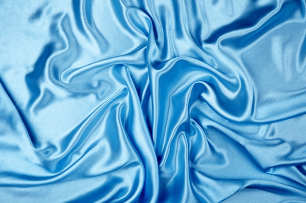 Blue luxury satin fabric texture for background