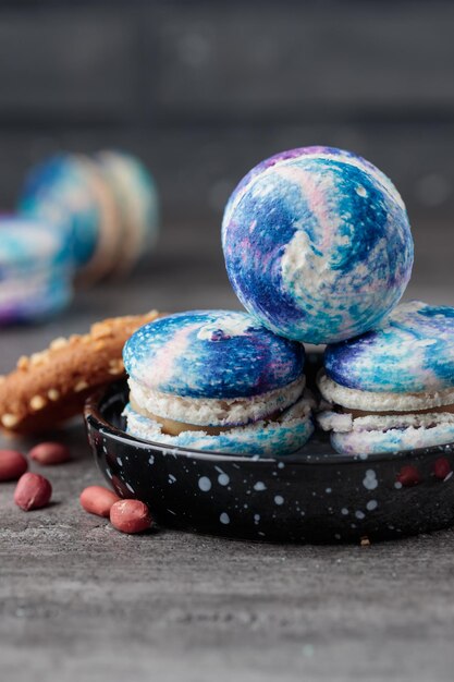 Blue macaroons on a grey concrete background