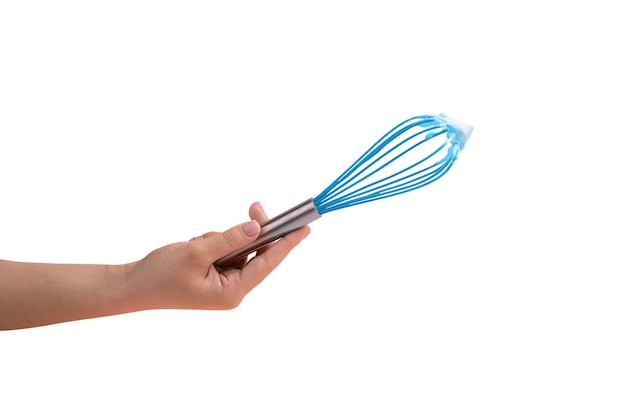 Blue manual whisk in hand isolated on white background dessert cooking concept