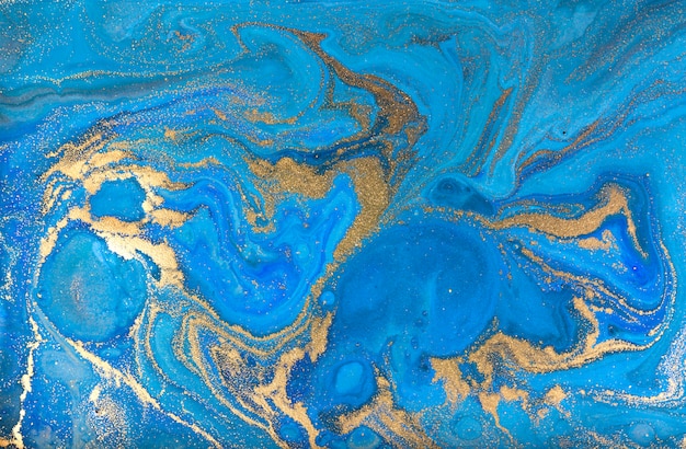 Blue marbling background. Golden marble liquid texture.