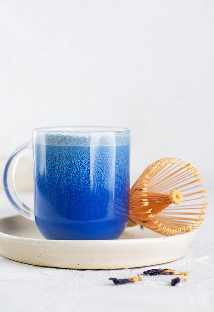 Blue matcha latte drink or Anchan tea from clitoria flowers with coconut milk and chasen