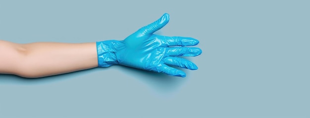 Photo blue medical glove on human hand isolated