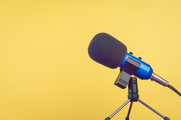 The blue microphone with the wire on yellow