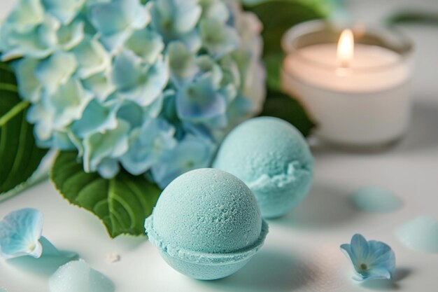 Blue mint bath bombs with hortensia on white table lit candle