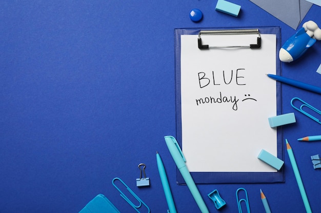 Blue Monday text and stationery on blue background space for text