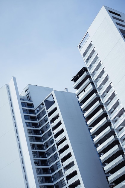 Blue monochrome image of modern multistory residential buildings