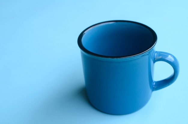 blue mug mockup on blue background empty space