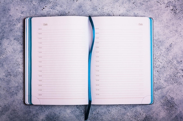 Blue note pads on concrete background