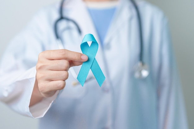 blue november prostate cancer awareness month doctor with blue ribbon in hospital