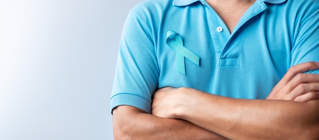 Blue november prostate cancer awareness month man in blue shirt\
with blue ribbon for support people life and illness healthcare\
international men father diabetes and world cancer day