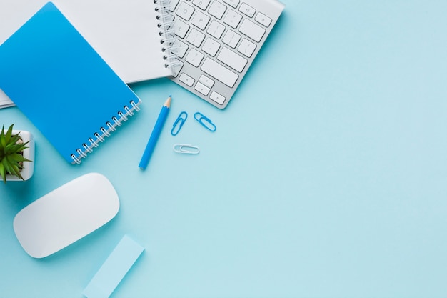 Blue office stationery and keyboard