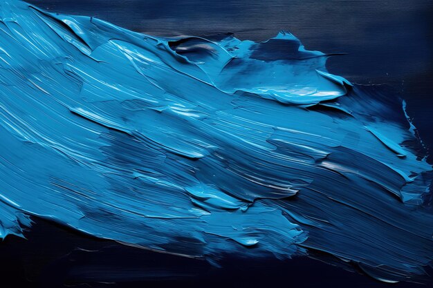 Blue oil paint on a black background