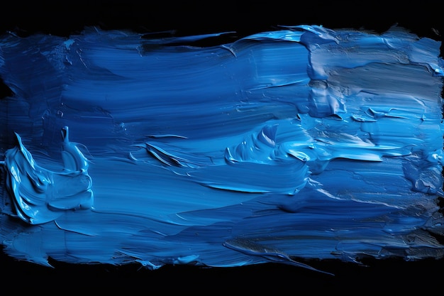 Blue oil paint on a black background