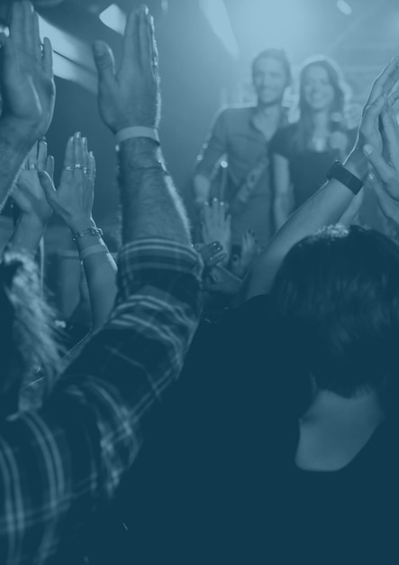 Blue overlay over group of people enjoying at a music concert