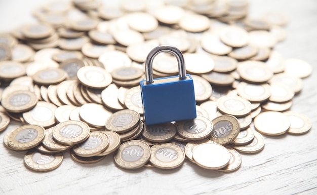 Blue padlock and coins. Finance.