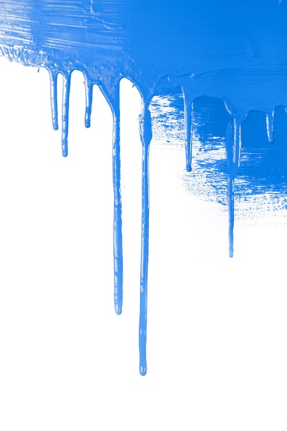 Blue paint flows isolated on white background with copy space real photo