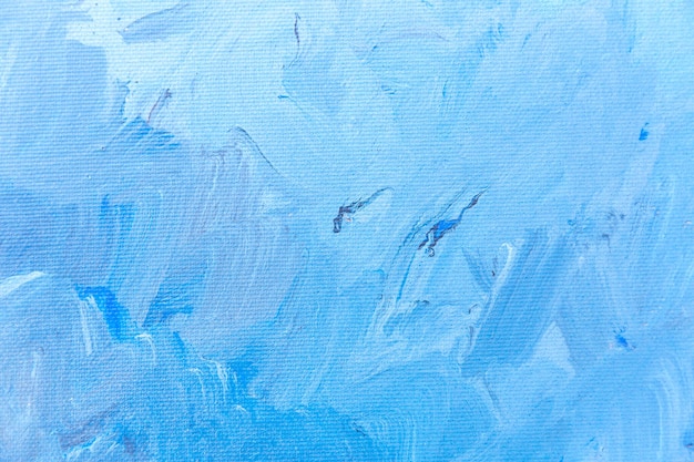Синий окрашенный холст с мазками кисти в качестве фона