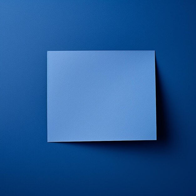 A blue paper on blue plain background