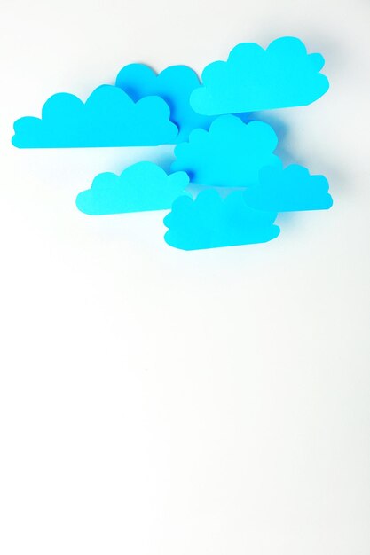 Photo blue paper clouds isolated on white cloud computing concept
