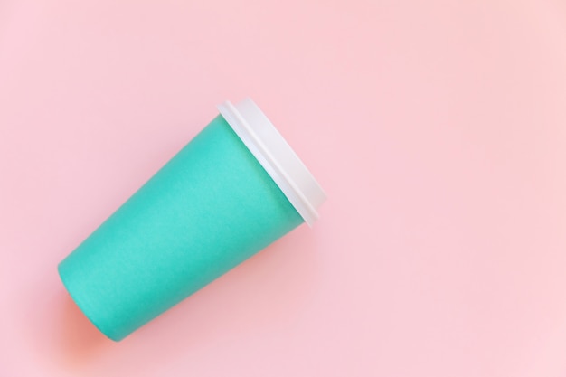 blue paper coffee cup on pink background