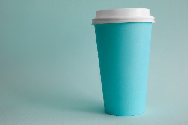 Blue paper cup of coffee