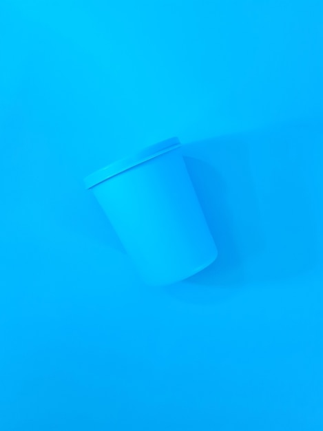 Blue Pastic Cup Isolated on Blue Background