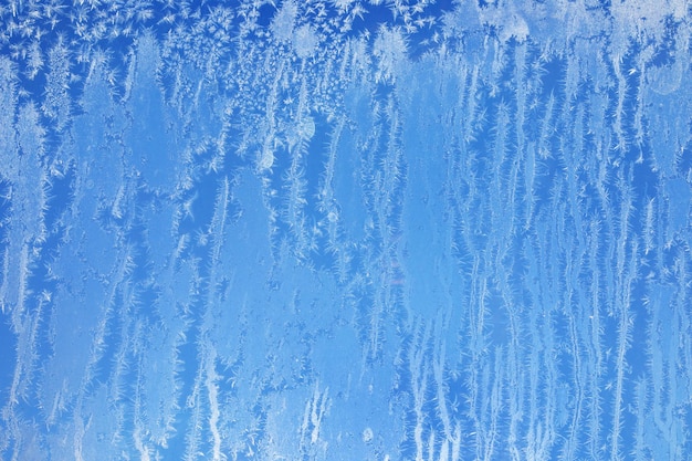 Синий узор на стекле абстрактный естественный фон.